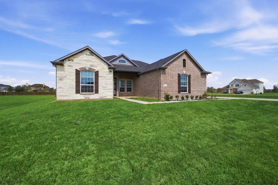 Front exterior of a new home in Suncreek Estates, Rosharon, TX, highlighting curb appeal (Image 22). Front exterior of a new home in Suncreek Estates, Rosharon, TX, highlighting curb appeal (Image 22).