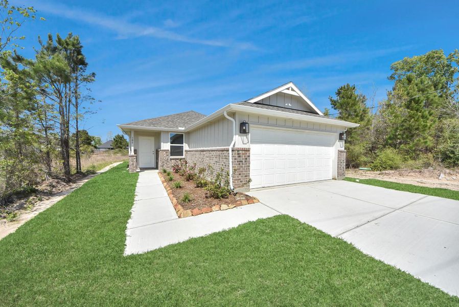 Front exterior of a new home in Santa Fe, Cleveland, TX, highlighting curb appeal (Image 20).
