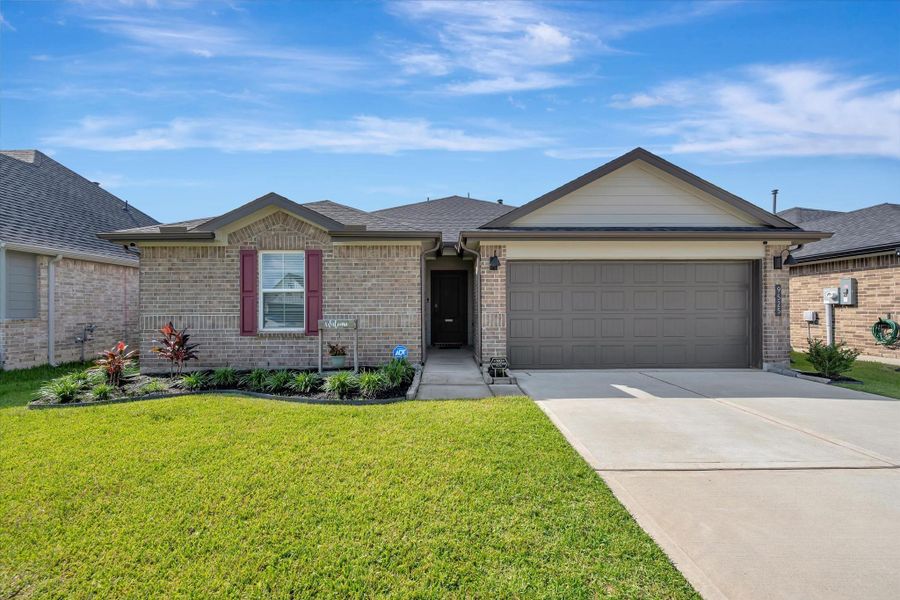 Front exterior of a new home in Central Park, Texas City, TX, highlighting curb appeal (Image 2). Front exterior of a new home in Central Park, Texas City, TX, highlighting curb appeal (Image 2).