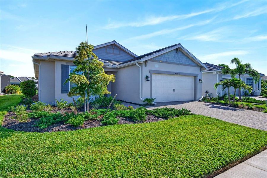 Front exterior of a new home in , Englewood, FL, highlighting curb appeal (Image 22).