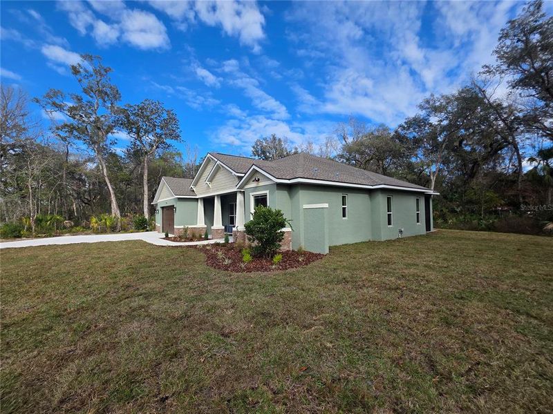 Front exterior of a new home in , Brooksville, FL, highlighting curb appeal (Image 26).