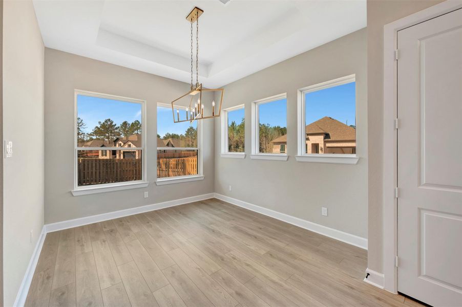 Spacious Dining area with lots of windows and light with no neighbors next to you!