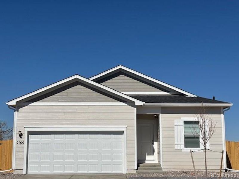 Front exterior of a new home in Cottonwood Greens, Fort Lupton, CO, highlighting curb appeal (Image 14).