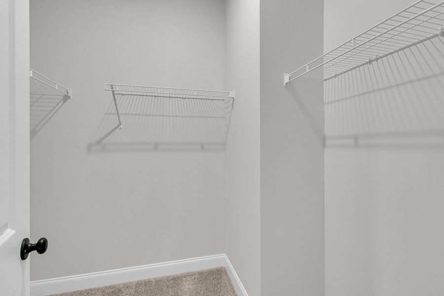 Spacious, unfurnished interior of a new home in Tidewater at Lakes of Cane Bay, Summerville (Image 53).