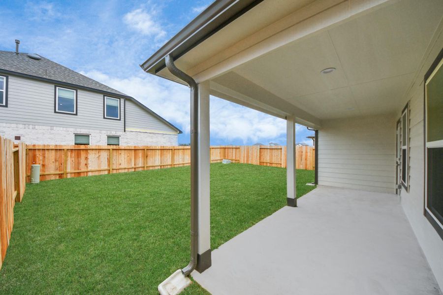 Come and see this spacious backyard with its beautiful covered patio. There is plenty ofroom for the kids to play and adults to relax. Perfect for your outdoor living space, patiofurniture, bbq pit, and so much more. The possibilities are endless! Sample photo of completed home with similar floor plan. Actual colors and selections may vary.