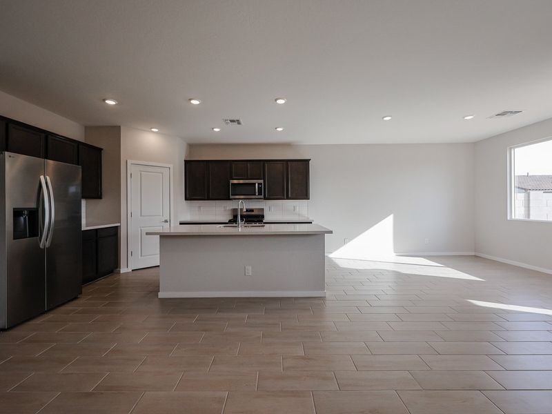 A kitchen with black appliances. A kitchen with black appliances.