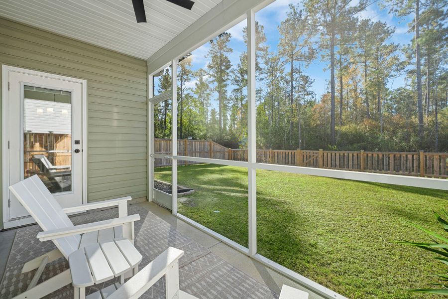 Exterior details and patio area of a home in Jasmine Point at Lakes of Cane Bay, Summerville (Image 28).