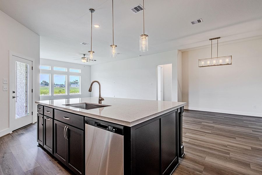 Oversized island kitchen ideal for meal preparation, casual dining, and entertaining Oversized island kitchen ideal for meal preparation, casual dining, and entertaining