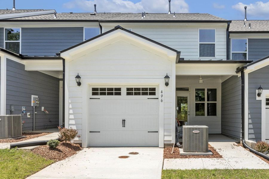 Front exterior of a new home in Enclave at Traditions Townhomes, Wake Forest, NC, highlighting curb appeal (Image 17).