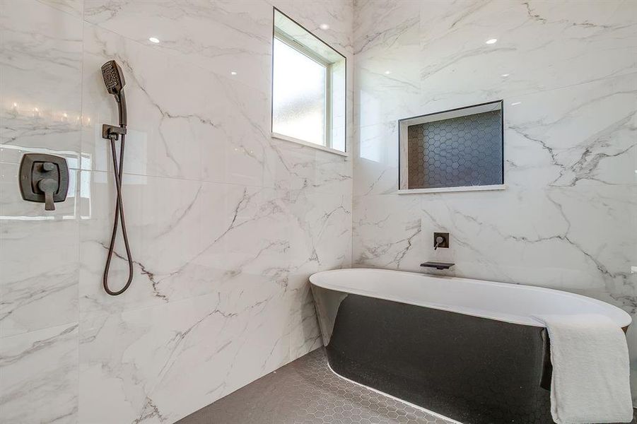 Full bathroom with a freestanding bath