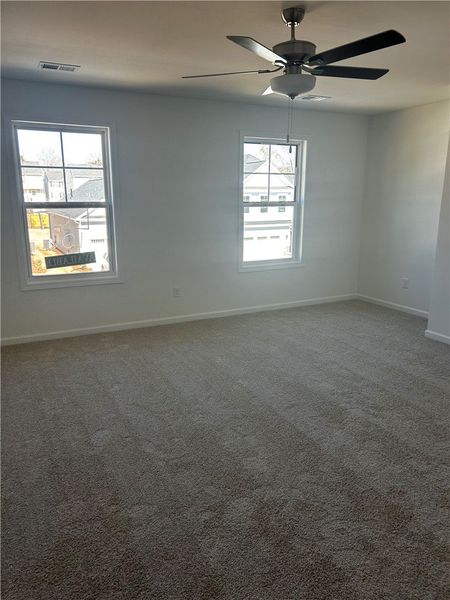 This spacious room features ample natural light an