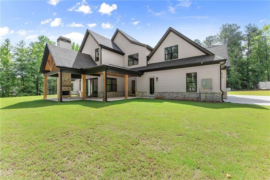 Front exterior of a new home in , Hoschton, GA, highlighting curb appeal (Image 29).