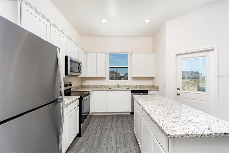 Furnished interior view inside a new home in Sol Vista, Dundee (Image 6).