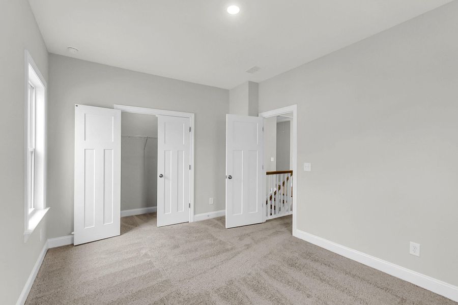 Spacious, unfurnished interior of a new home in Tidewater at Lakes of Cane Bay, Summerville (Image 34).