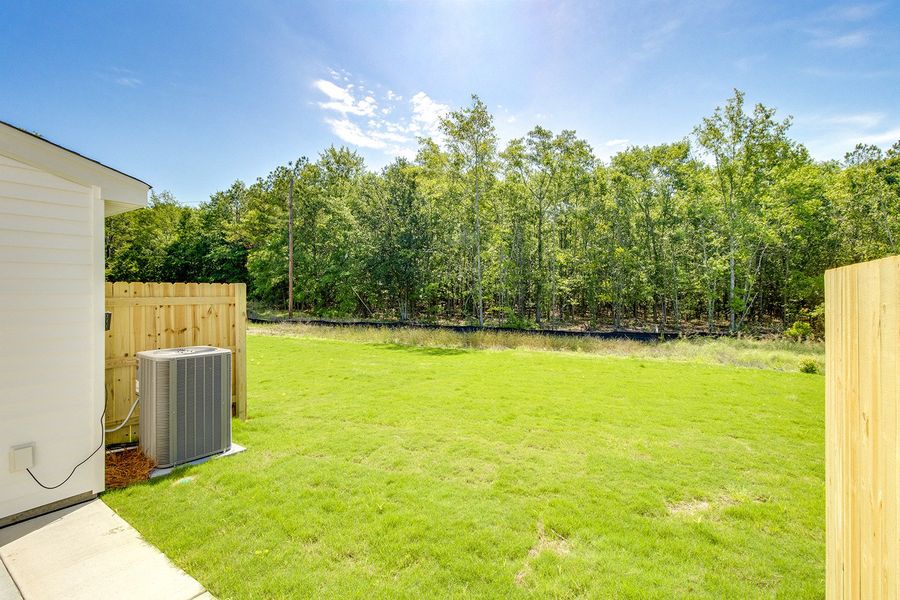 Exterior details and patio area of a home in Padgett Commons, Hopkins (Image 4).