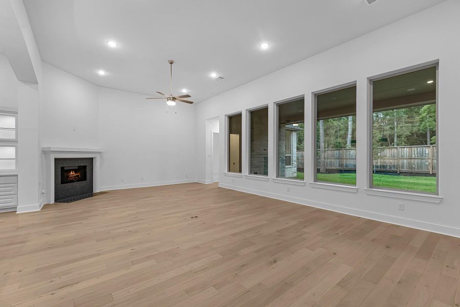 Additional view of the family room with tile accented gas fireplace. Additional view of the family room with tile accented gas fireplace.
