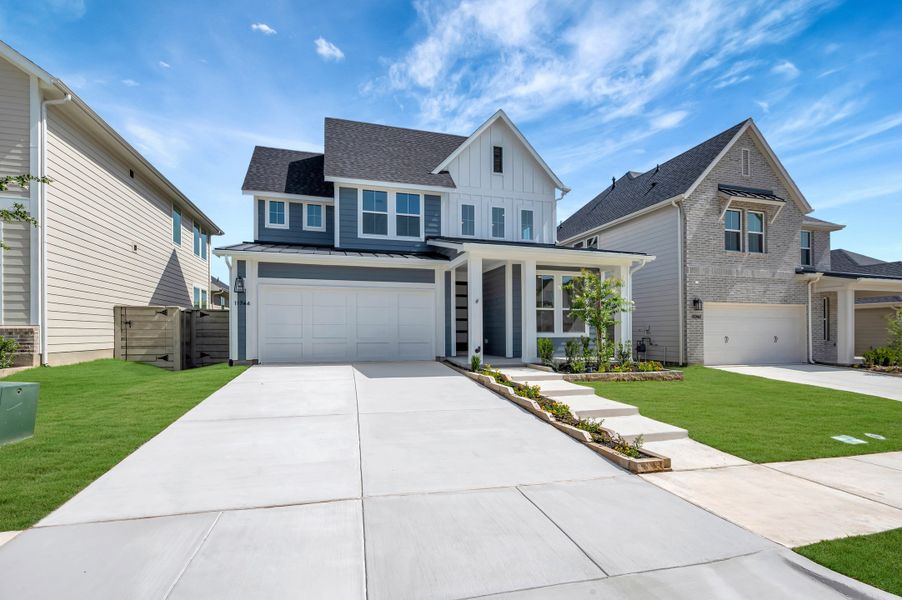 Front exterior of a new home in Treeline, Justin, TX, highlighting curb appeal (Image 21). Front exterior of a new home in Treeline, Justin, TX, highlighting curb appeal (Image 21).