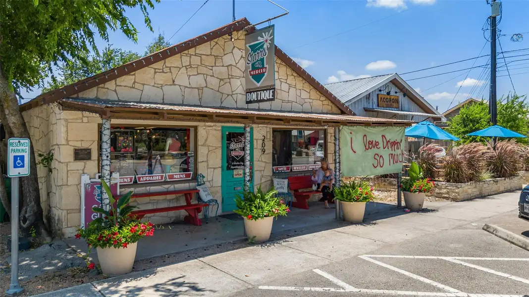 Front exterior of a new home in Cannon Ranch 40s, Dripping Springs, TX, highlighting curb appeal (Image 1). Front exterior of a new home in Cannon Ranch 40s, Dripping Springs, TX, highlighting curb appeal (Image 1).