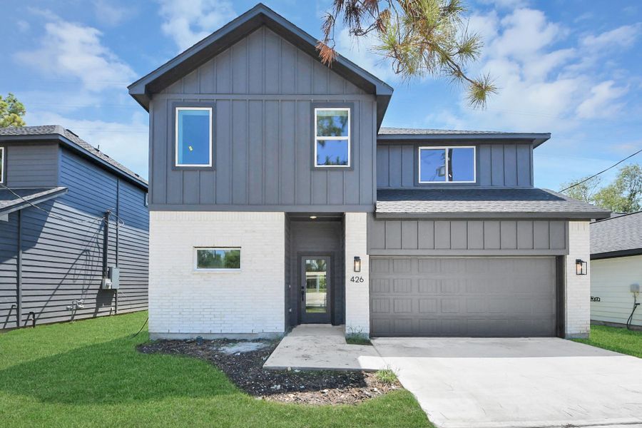 Front exterior of a new home in , Huffman, TX, highlighting curb appeal (Image 21).