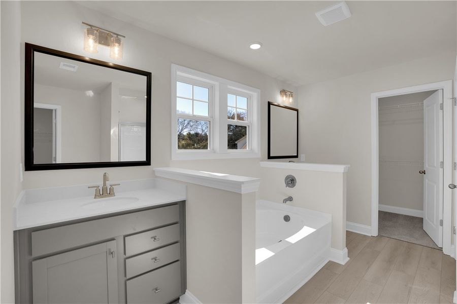 Bright and airy, this spacious bathroom features m Bright and airy, this spacious bathroom features m