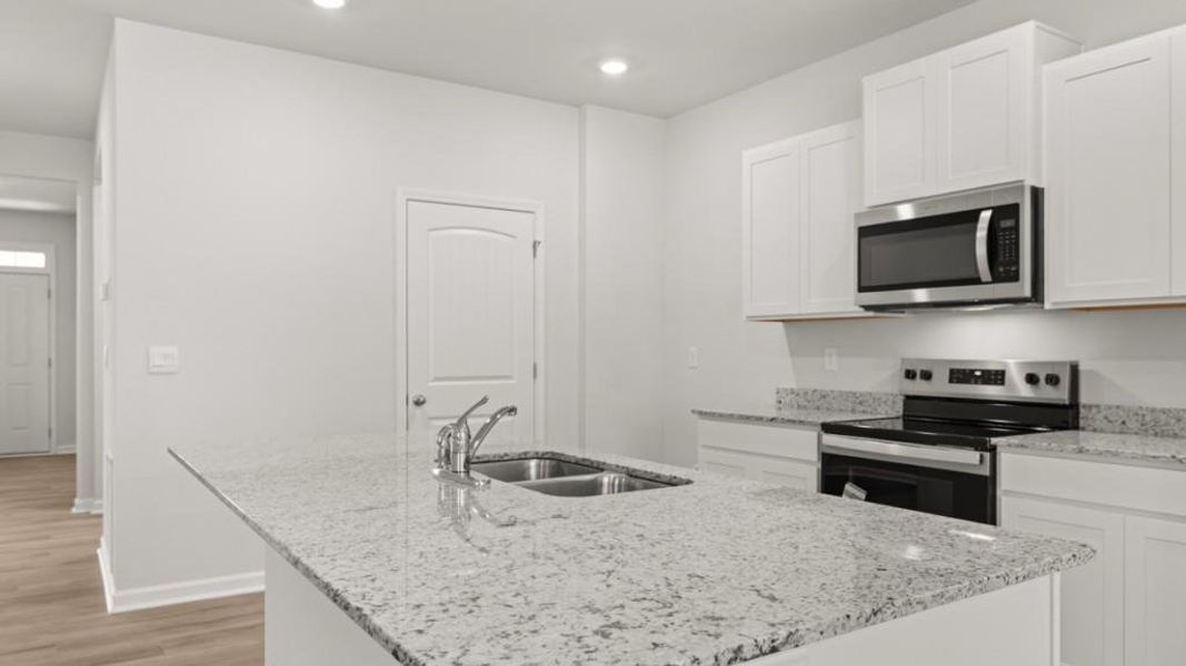 Furnished interior view inside a new home in Oaks at Cedar Grove, Fairburn (Image 6).