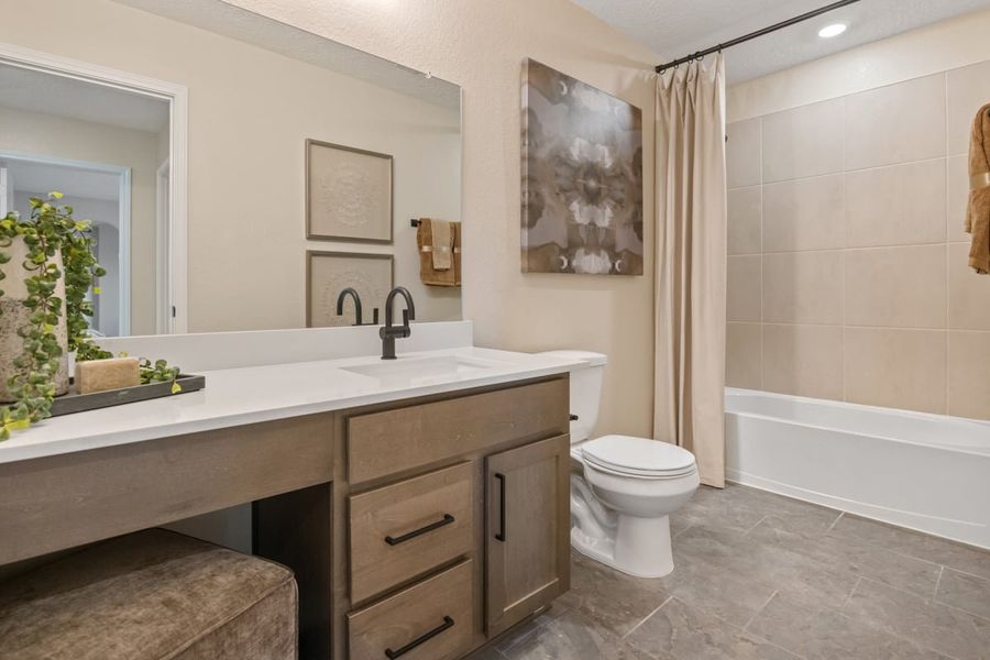 Representative furnished interior of a home built from the 2444 Modeled by KB Home in Saddlebrook Preserve, Beasley (Image 14).