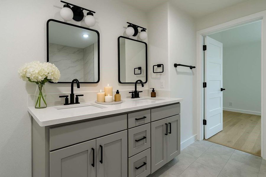 Jack and Jill bathroom with 2 sinks and plenty of storage space.
