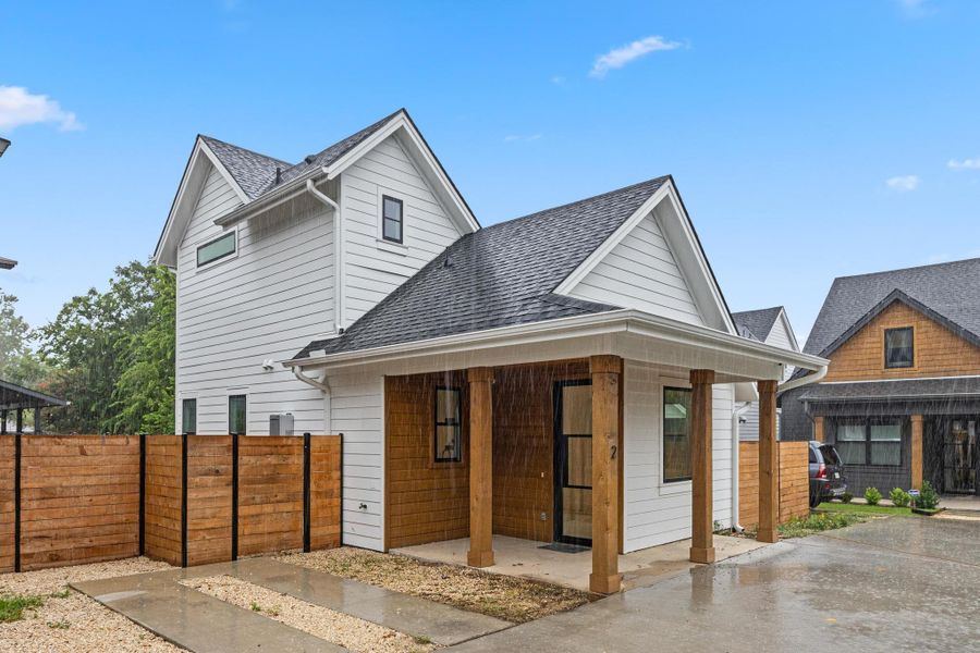 View of front of home with a shingled roof and a porch View of front of home with a shingled roof and a porch