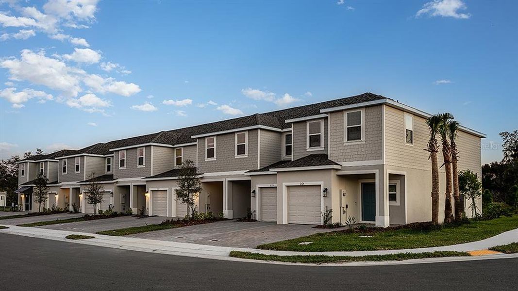 Front exterior of a new home in Horse Creek at Crosswinds, Davenport, FL, highlighting curb appeal (Image 8).