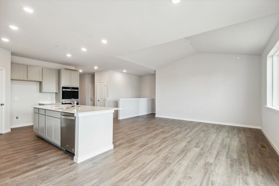 A large kitchen with white cabinets.