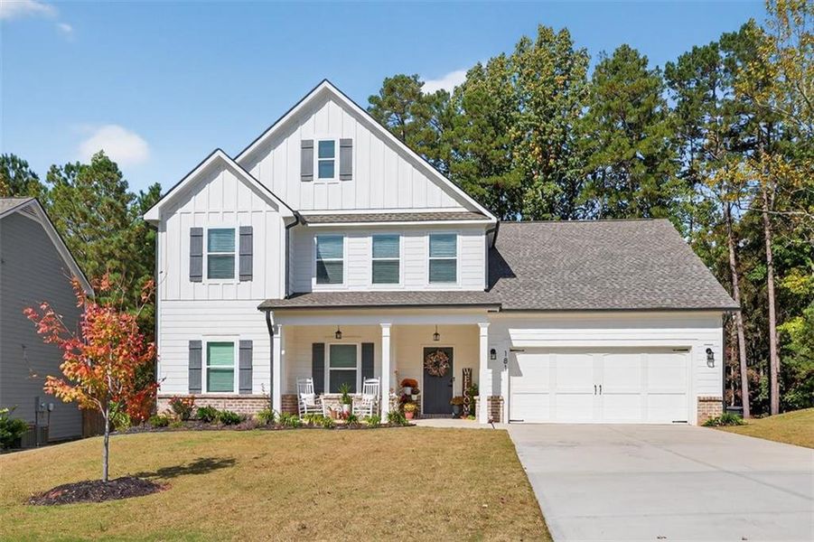 Front exterior of a new home in Calgary Downs, Winder, GA, highlighting curb appeal (Image 1). Front exterior of a new home in Calgary Downs, Winder, GA, highlighting curb appeal (Image 1).