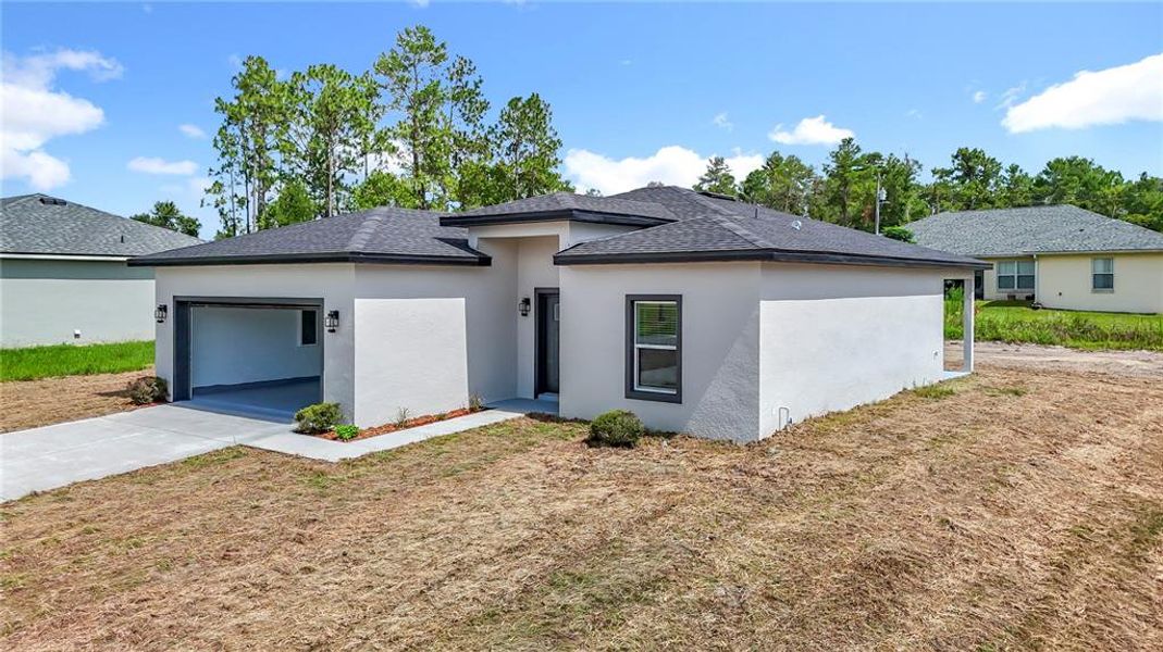 Front exterior of a new home in , Ocala, FL, highlighting curb appeal (Image 2).