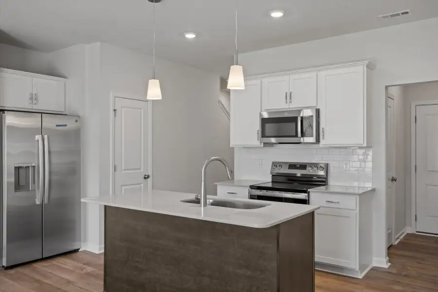 Furnished interior view inside a new home in West Main Townhomes, Sanford (Image 6).