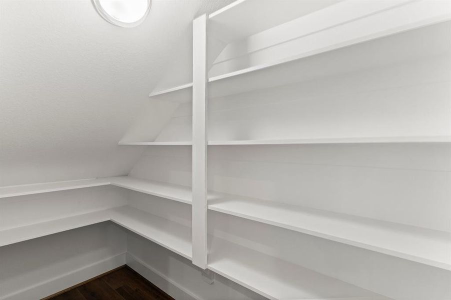 This is a spacious pantry with ample shelving for organized storage