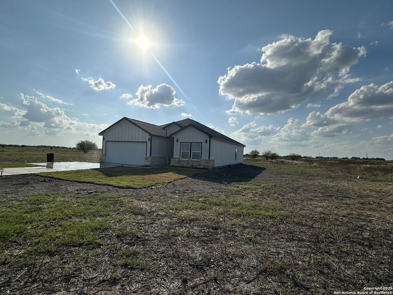 Front exterior of a new home in , D'Hanis, TX, highlighting curb appeal (Image 15). Front exterior of a new home in , D'Hanis, TX, highlighting curb appeal (Image 15).