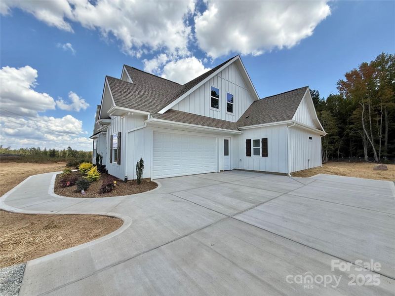 Front exterior of a new home in , Waxhaw, NC, highlighting curb appeal (Image 2). Front exterior of a new home in , Waxhaw, NC, highlighting curb appeal (Image 2).