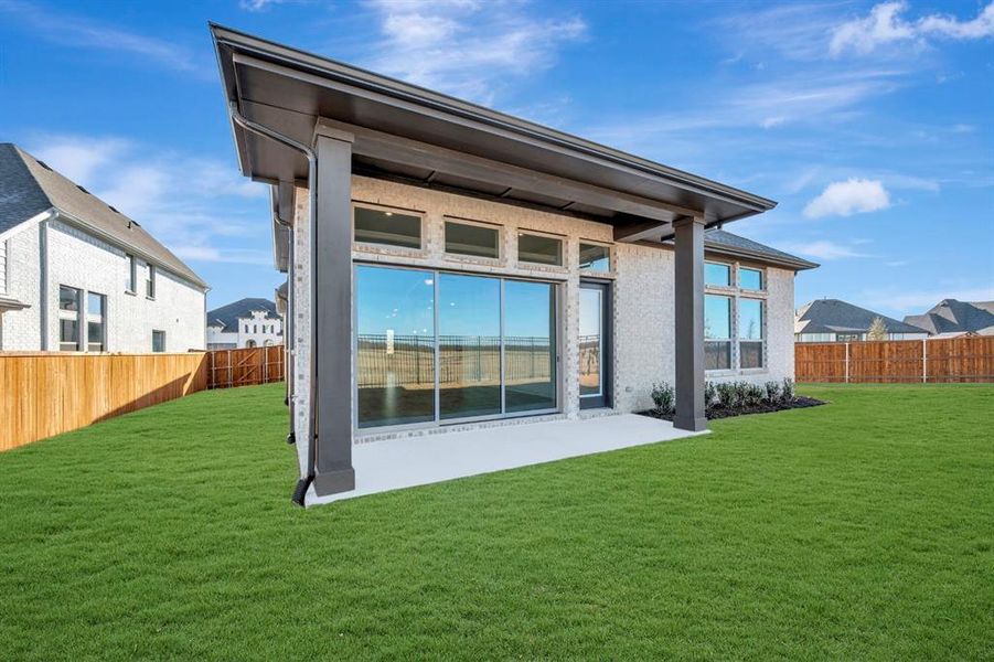 Back of house with a fenced backyard and a patio Back of house with a fenced backyard and a patio