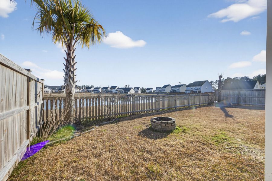 Exterior details and patio area of a home in Azalea Ridge at Summers Corner: Arbor Collection, Summerville (Image 24).