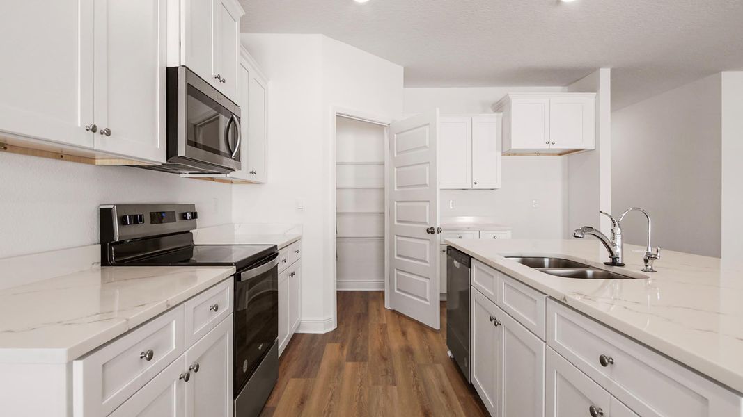 Furnished interior view inside a new home in Bayside at Ward Creek, Panama City Beach (Image 6).