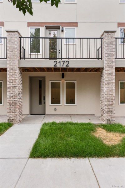 Front exterior of a new home in , Denver, CO, highlighting curb appeal (Image 2).