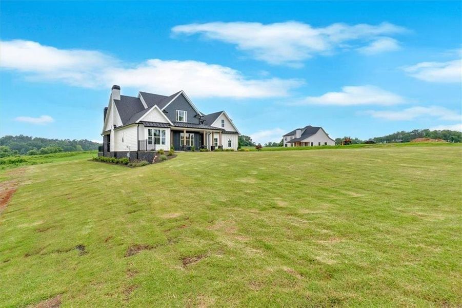 Front exterior of a new home in , Rydal, GA, highlighting curb appeal (Image 2). Front exterior of a new home in , Rydal, GA, highlighting curb appeal (Image 2).