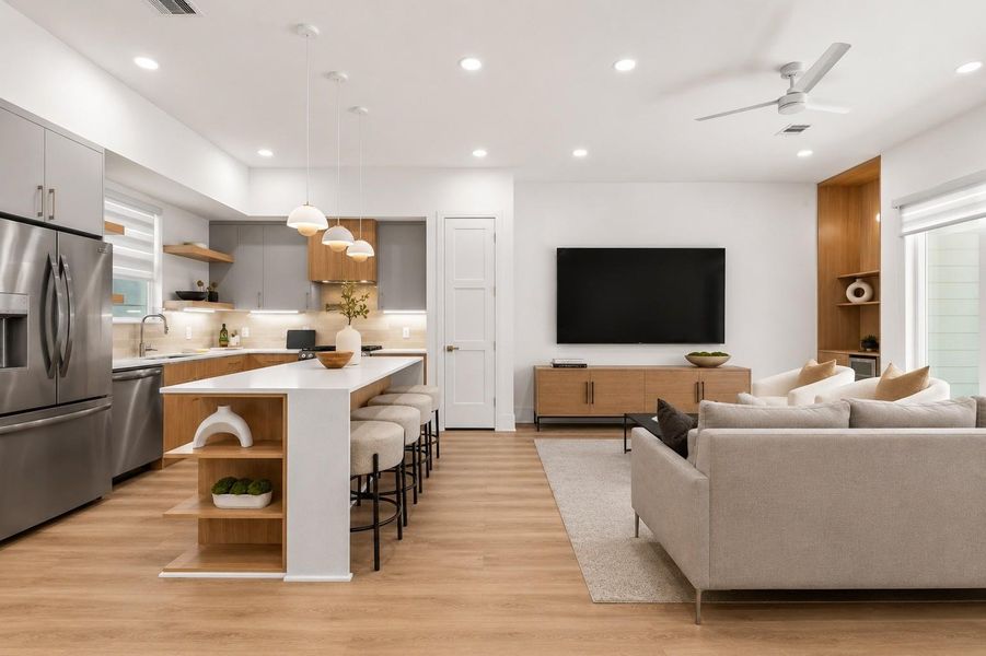 The second-floor living level unfolds as a seamless sequence of interconnected spaces, where warm materiality, clean horizontal lines, and abundant natural light shape the rhythm of daily life.