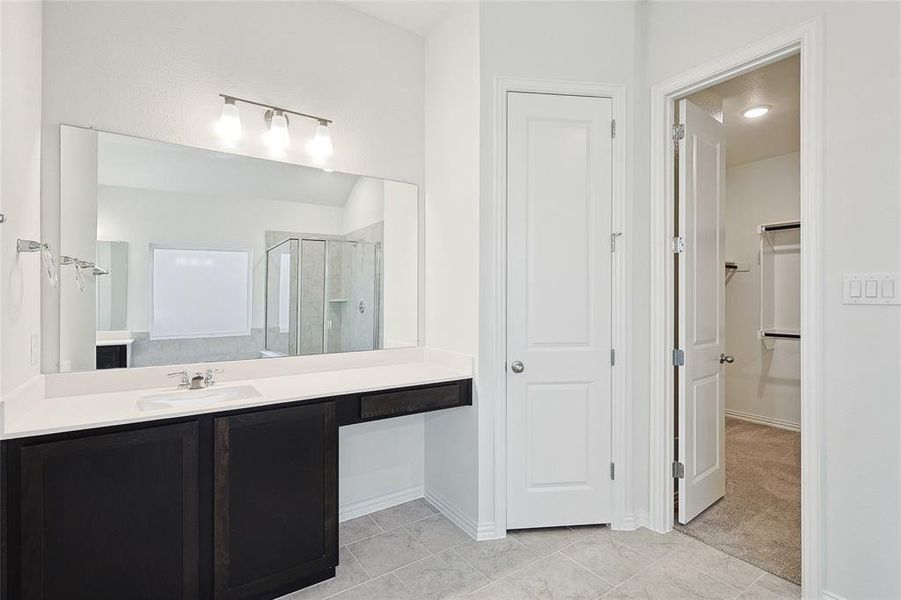 Bathroom with vanity and walk in shower