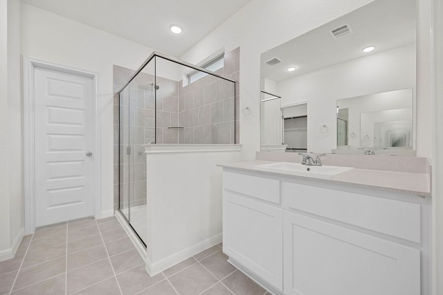 Primary Bath in the Elm home plan by Trophy Signature Homes – REPRESENTATIVE PHOTO
