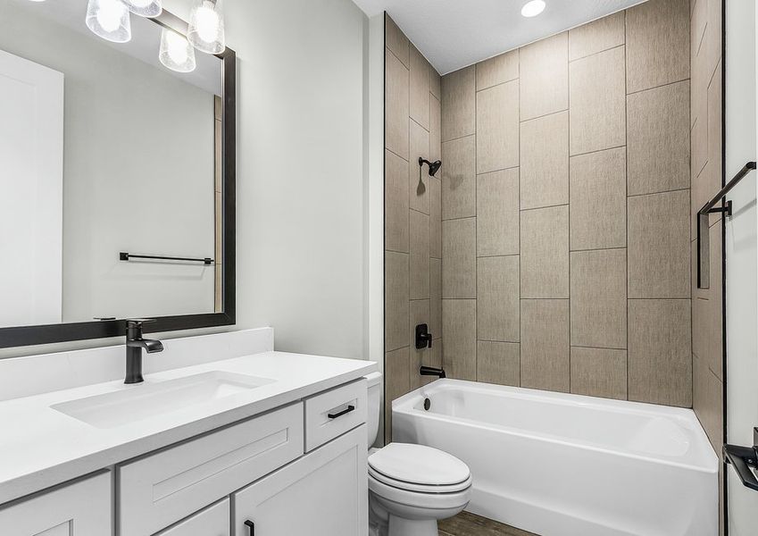 Secondary bathroom with large vanity.