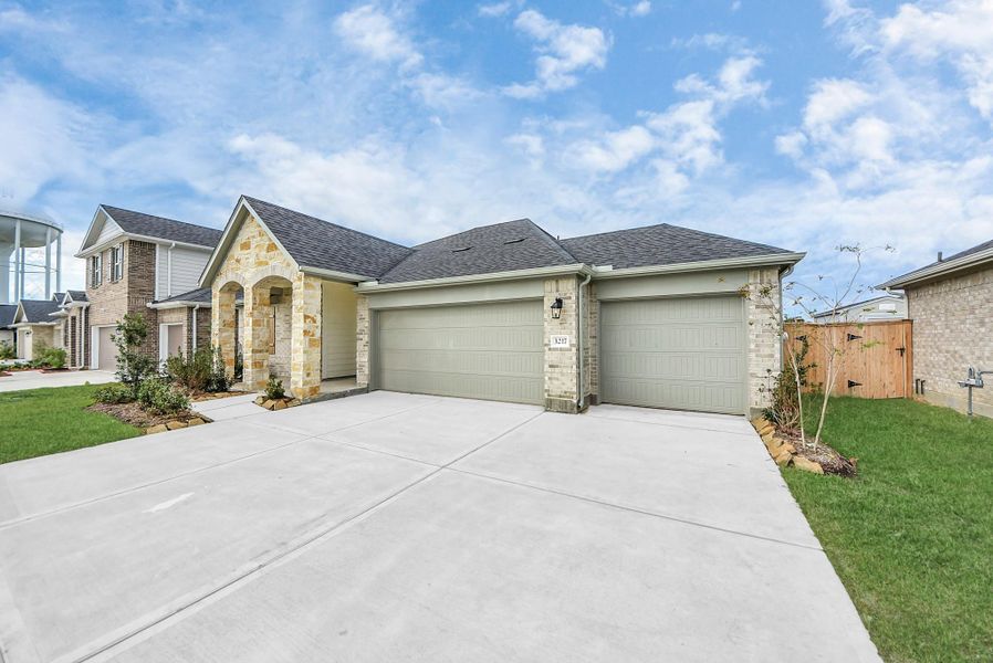 Front exterior of a new home in Sunrise Cove: Landmark Collection, Texas City, TX, highlighting curb appeal (Image 21).