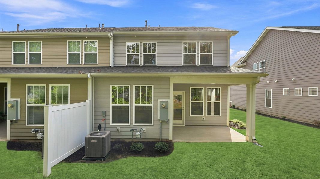 Rear covered porch of the Lawson floorplan creates a seamless extension of this home’s elegant design in Greenville, SC