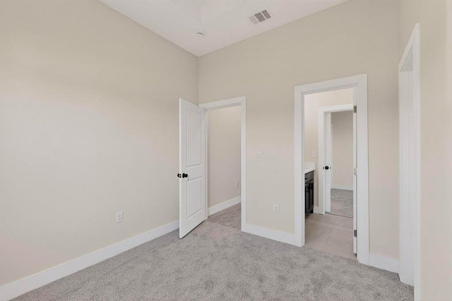 Secondary bedroom with Jack and Jill ensuite bathroom Secondary bedroom with Jack and Jill ensuite bathroom