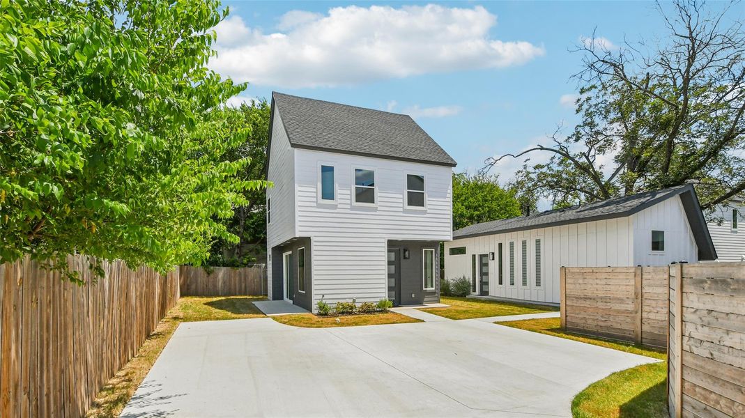 View of front of home with a shingled roof View of front of home with a shingled roof