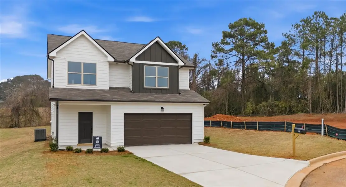 Front exterior of a new home in Creekside Manor, Thomaston, GA, highlighting curb appeal (Image 2). Front exterior of a new home in Creekside Manor, Thomaston, GA, highlighting curb appeal (Image 2).